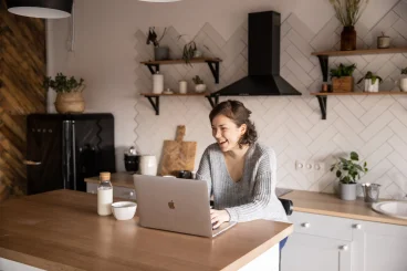 a happy woman with a laptop