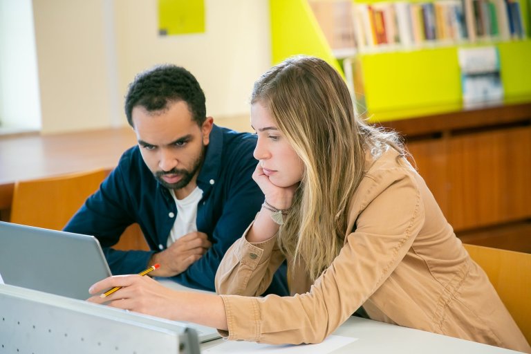 a couple with a laptop